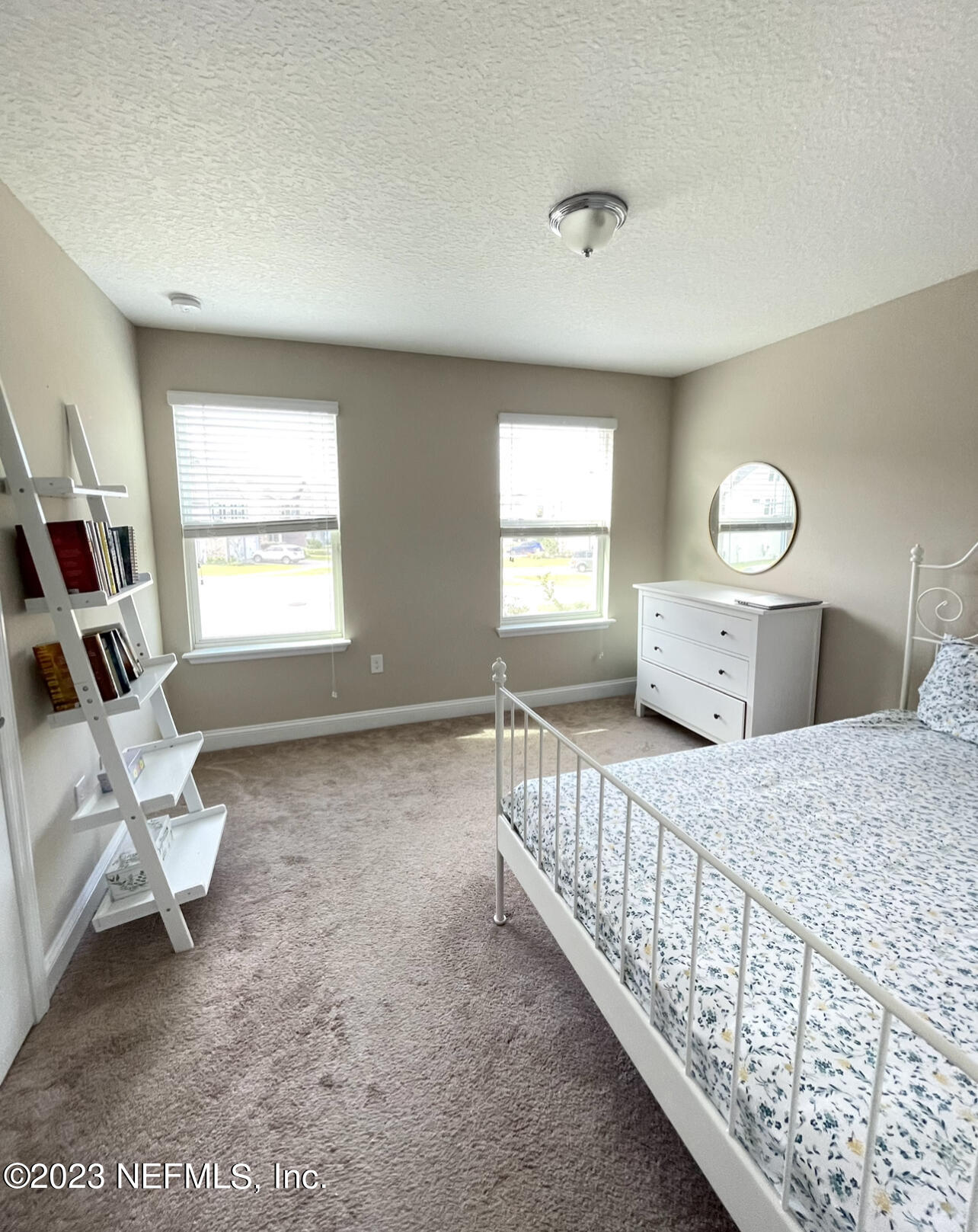 207 Silver Creek Place St. Augustine, FL 32095 - Photo 26 of 32 a view of a bedroom with wooden floor and windows