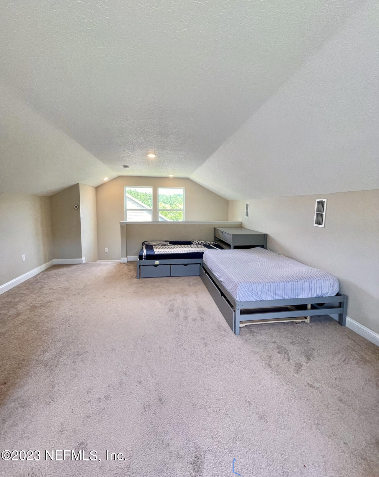 207 Silver Creek Place St. Augustine, FL 32095 - Photo 28 of 32 a spacious bedroom with a bed and a large window