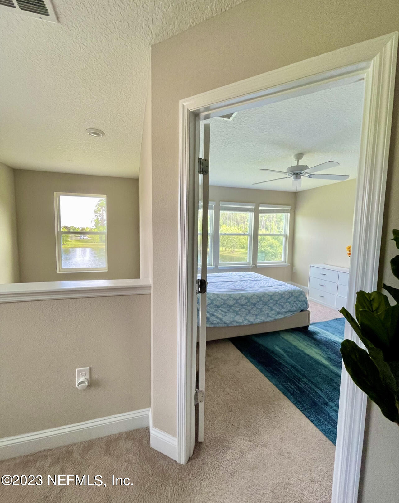 207 Silver Creek Place St. Augustine, FL 32095 - Photo 31 of 32 a bedroom with a bed and a window