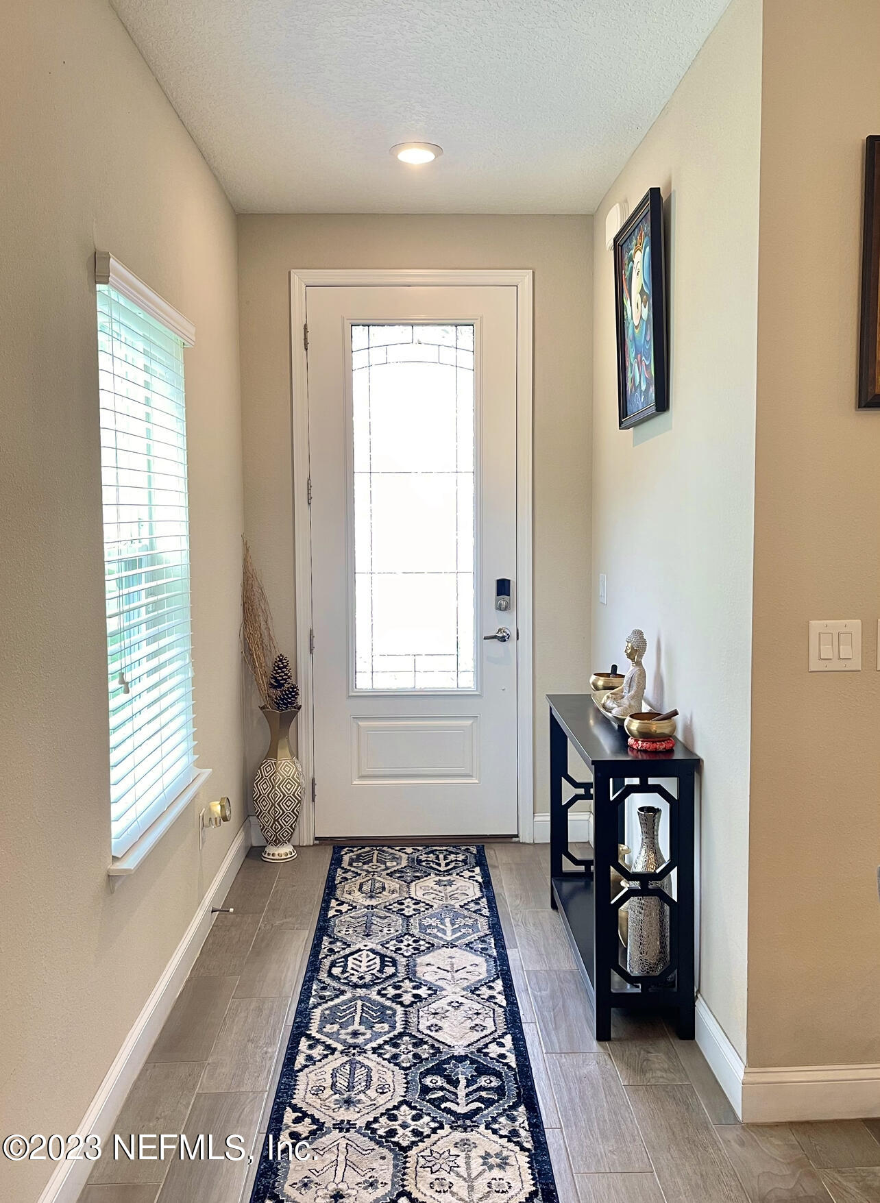207 Silver Creek Place St. Augustine, FL 32095 - Photo 5 of 32 a bathroom with a bathtub and a window