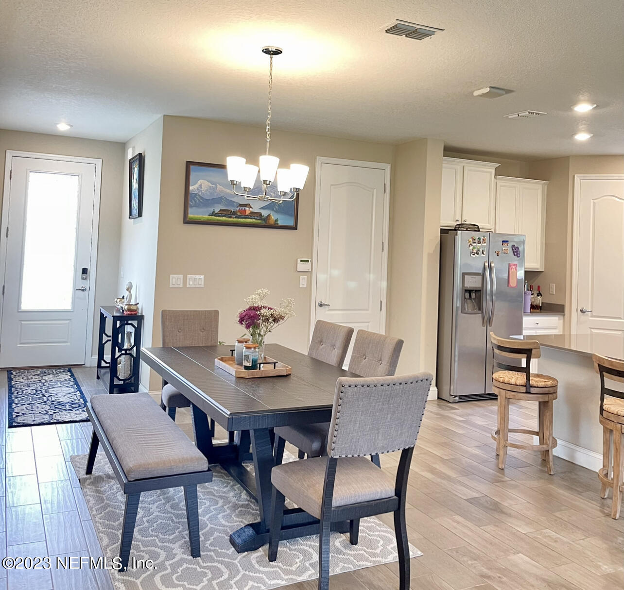 207 Silver Creek Place St. Augustine, FL 32095 - Photo 6 of 32 a view of a dining room with furniture and wooden floor