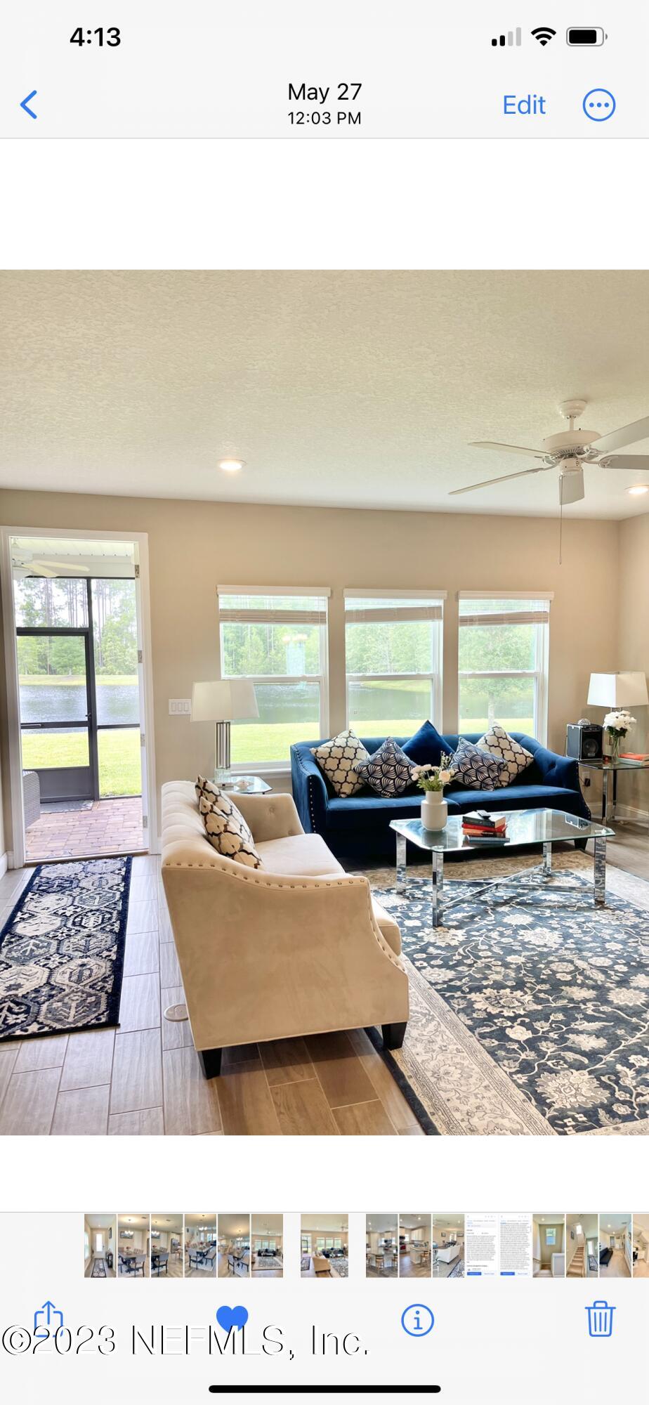 207 Silver Creek Place St. Augustine, FL 32095 - Photo 9 of 32 a living room with furniture and a table