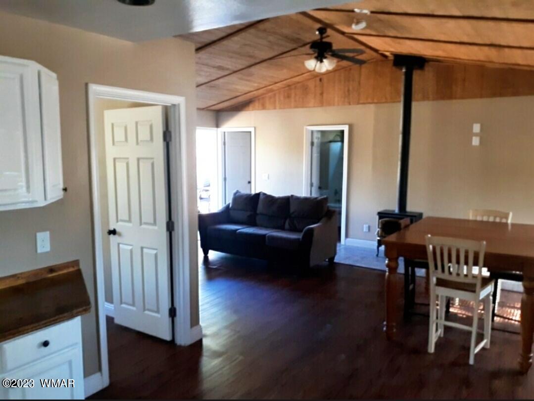 3521 Deer Track Trail Overgaard, AZ 85933 - Photo 2 of 7 a living room with furniture and wooden floor