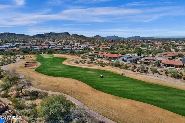 a view of a city with mountains in the background