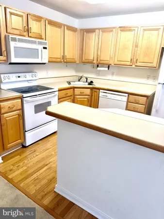 a kitchen with a sink and a window