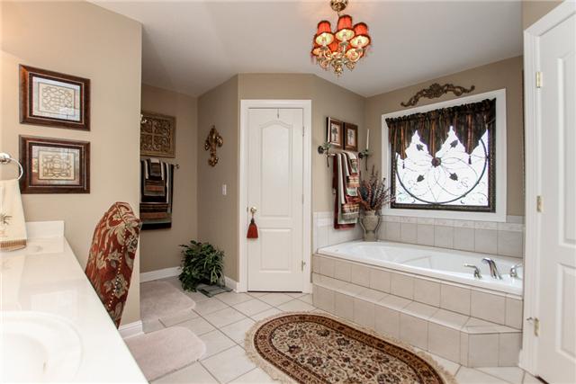 2465 Pleasant View Road Pleasant View, TN 37146 - Photo 11 of 20 The master bath has a whirlpool tub, separate shower, double vanities, and tile floors.
