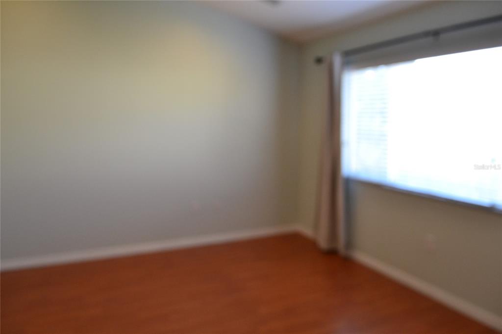 11235 Kapok Grand Circle Madeira Beach, FL 33708 - Photo 12 of 34 a view of an empty room and window