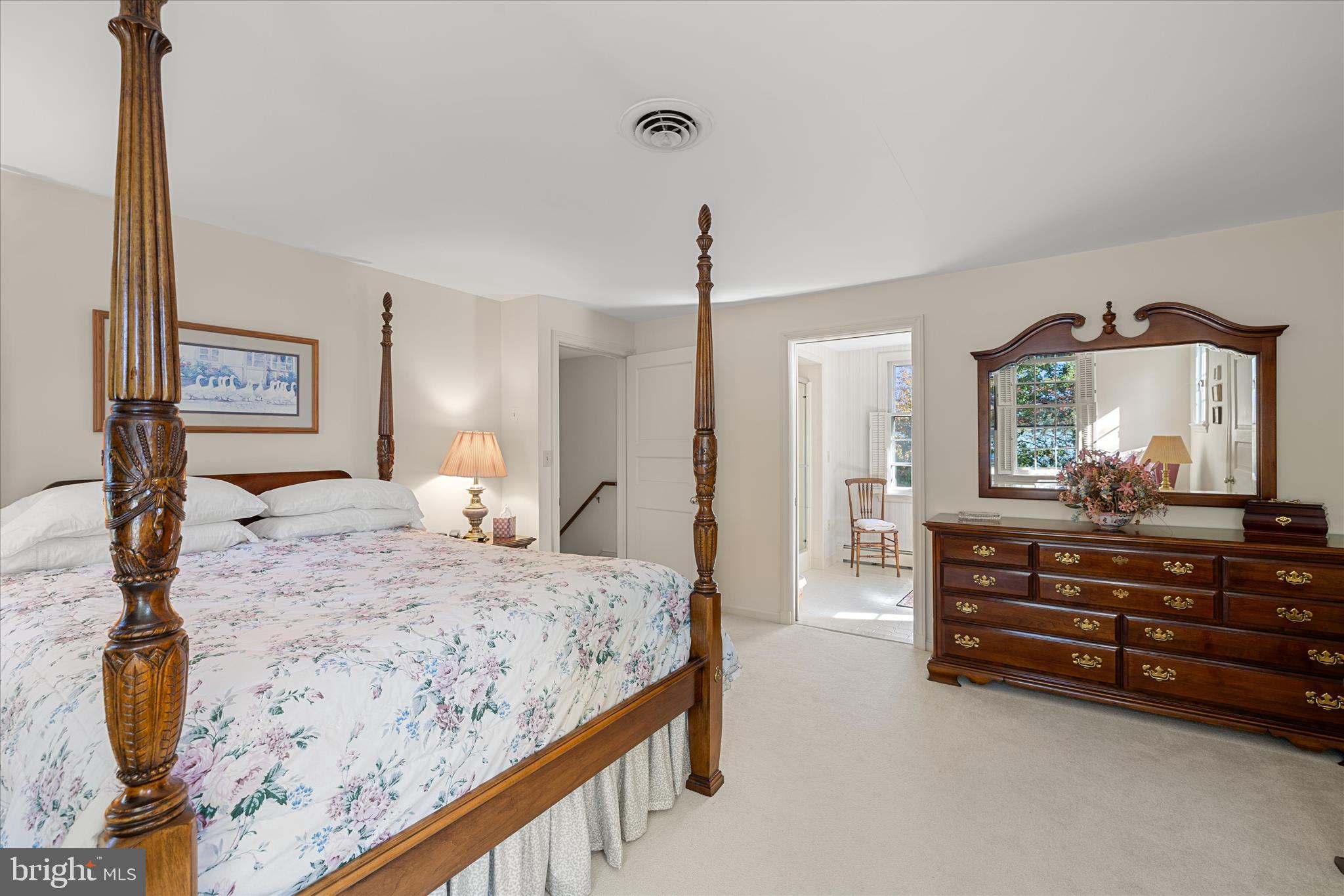 27473 Westpoint Road Easton, MD 21601 - Photo 25 of 58 a bedroom with a bed and a dresser