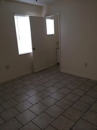 an empty room with windows