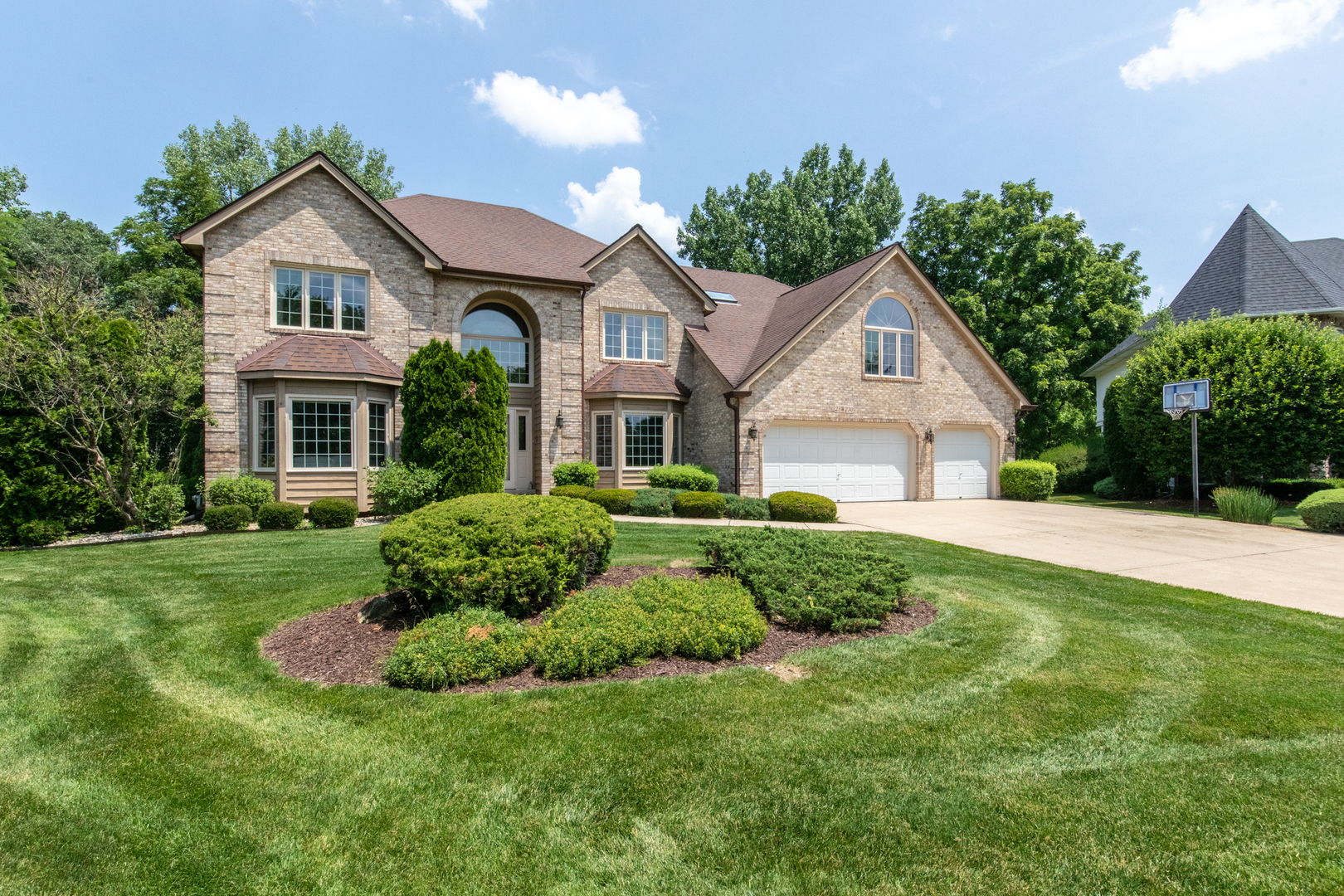 23W230 Hampton Circle Naperville, IL 60540 - Photo 2 of 55 a front view of a house with a yard