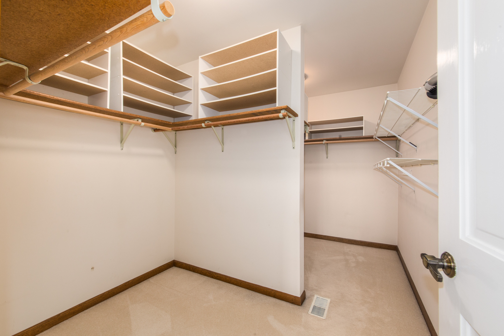 23W230 Hampton Circle Naperville, IL 60540 - Photo 24 of 55 a view of a room with racks on the wall