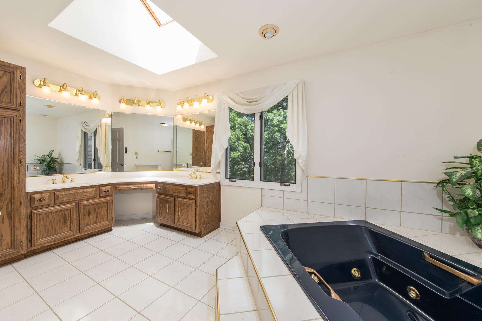 23W230 Hampton Circle Naperville, IL 60540 - Photo 25 of 55 a large bathroom with a large tub and sink