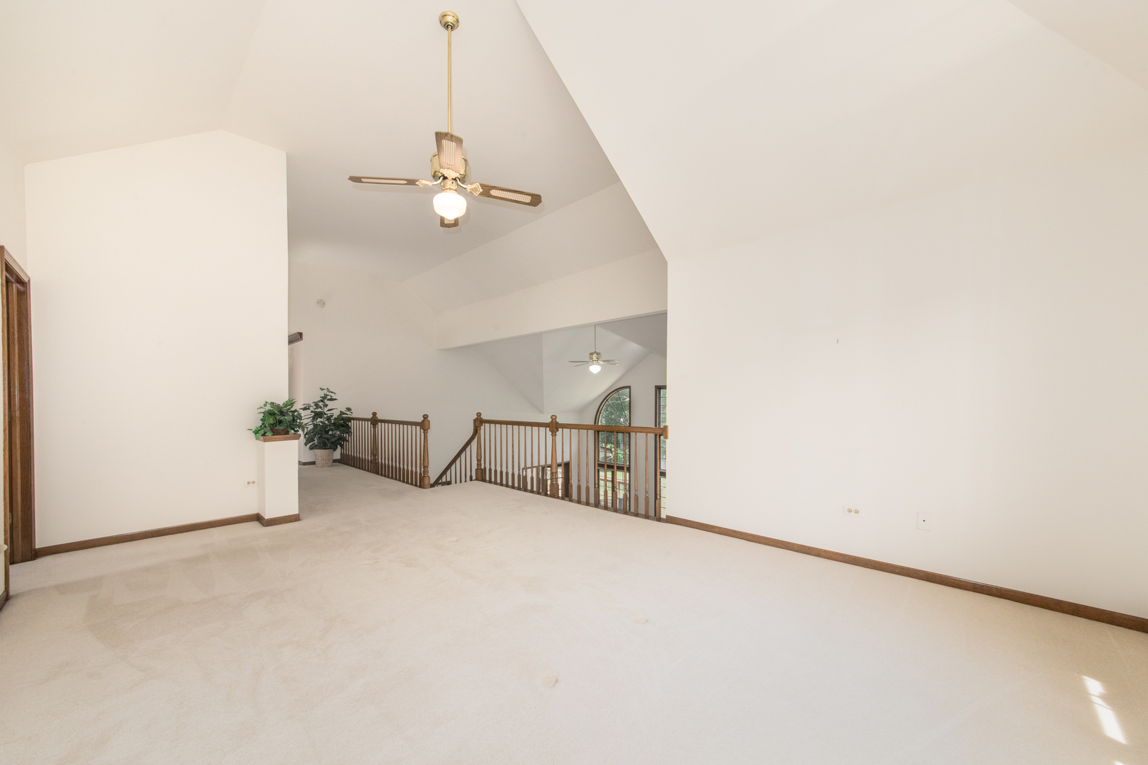 23W230 Hampton Circle Naperville, IL 60540 - Photo 30 of 55 an empty room with ceiling fan and window