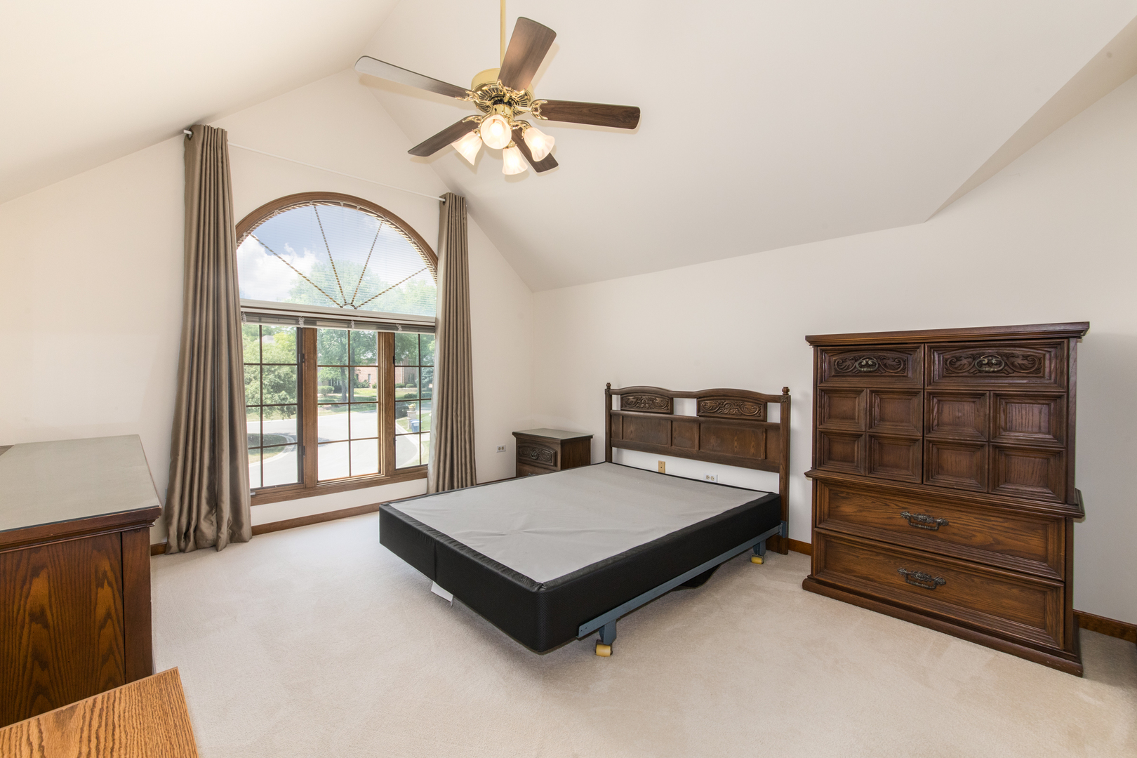 23W230 Hampton Circle Naperville, IL 60540 - Photo 33 of 55 a bedroom with a bed window and a chandelier