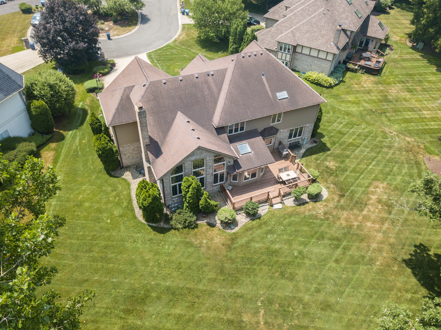 23W230 Hampton Circle Naperville, IL 60540 - Photo 52 of 55 an aerial view of a house with swimming pool and garden
