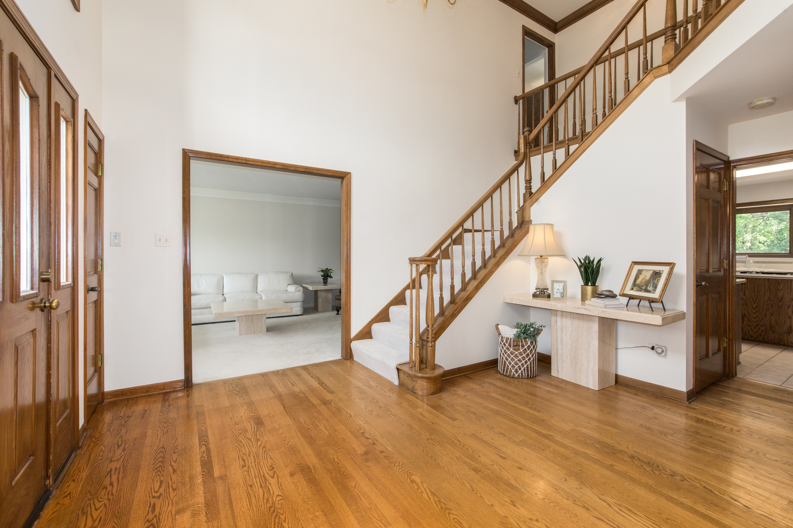 23W230 Hampton Circle Naperville, IL 60540 - Photo 6 of 55 a view of entryway and hall with wooden floor