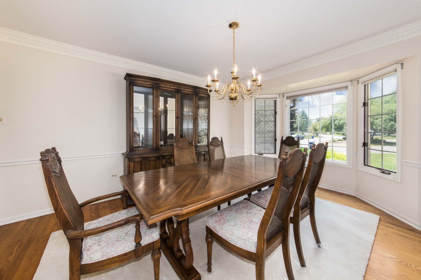 23W230 Hampton Circle Naperville, IL 60540 - Photo 9 of 55 a view of a dining room with furniture window and wooden floor