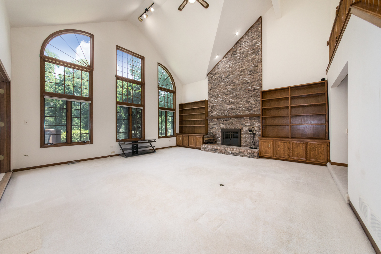 23W230 Hampton Circle Naperville, IL 60540 - Photo 10 of 55 an empty room with windows fireplace and windows