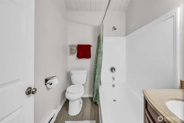 a white toilet sitting next to a bathroom sink