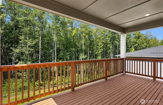 a view of balcony with wooden floor