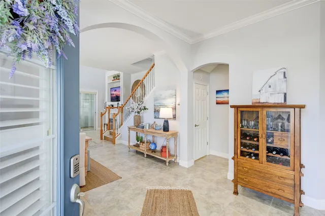 a view of a livingroom with furniture and staircase