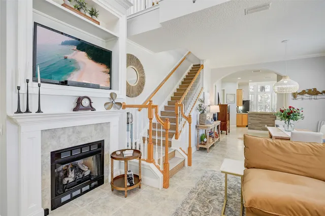 a living room with furniture and a fireplace