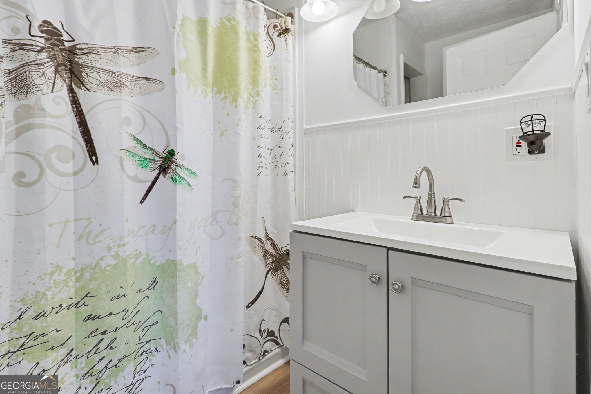 497 Corinth Road Hogansville, GA 30230 - Photo 15 of 37 a bathroom with a sink a mirror and shower
