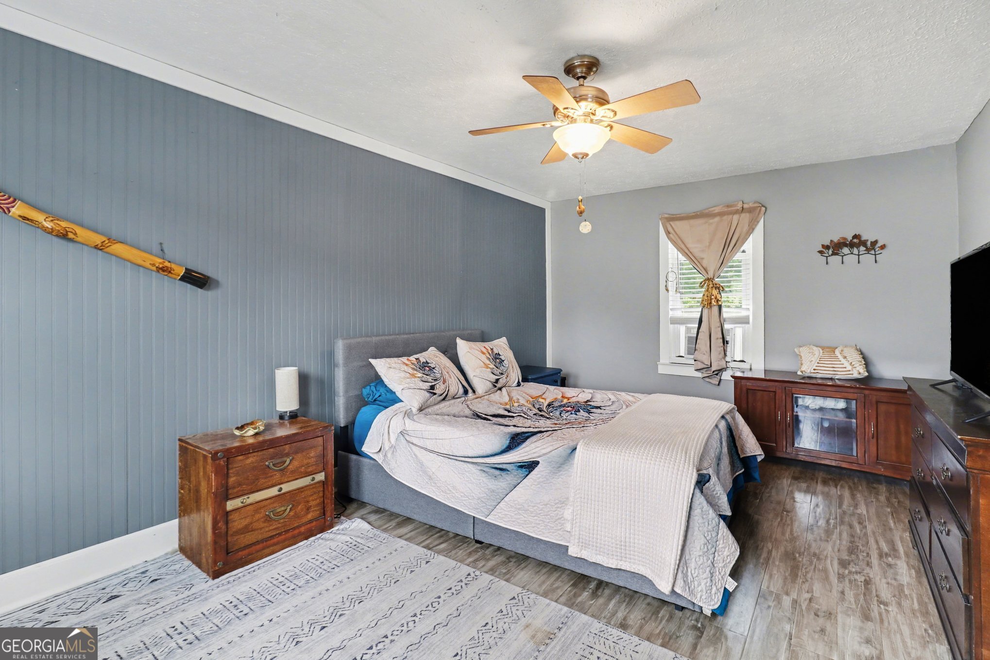 497 Corinth Road Hogansville, GA 30230 - Photo 22 of 37 a bedroom with a bed and wooden floor