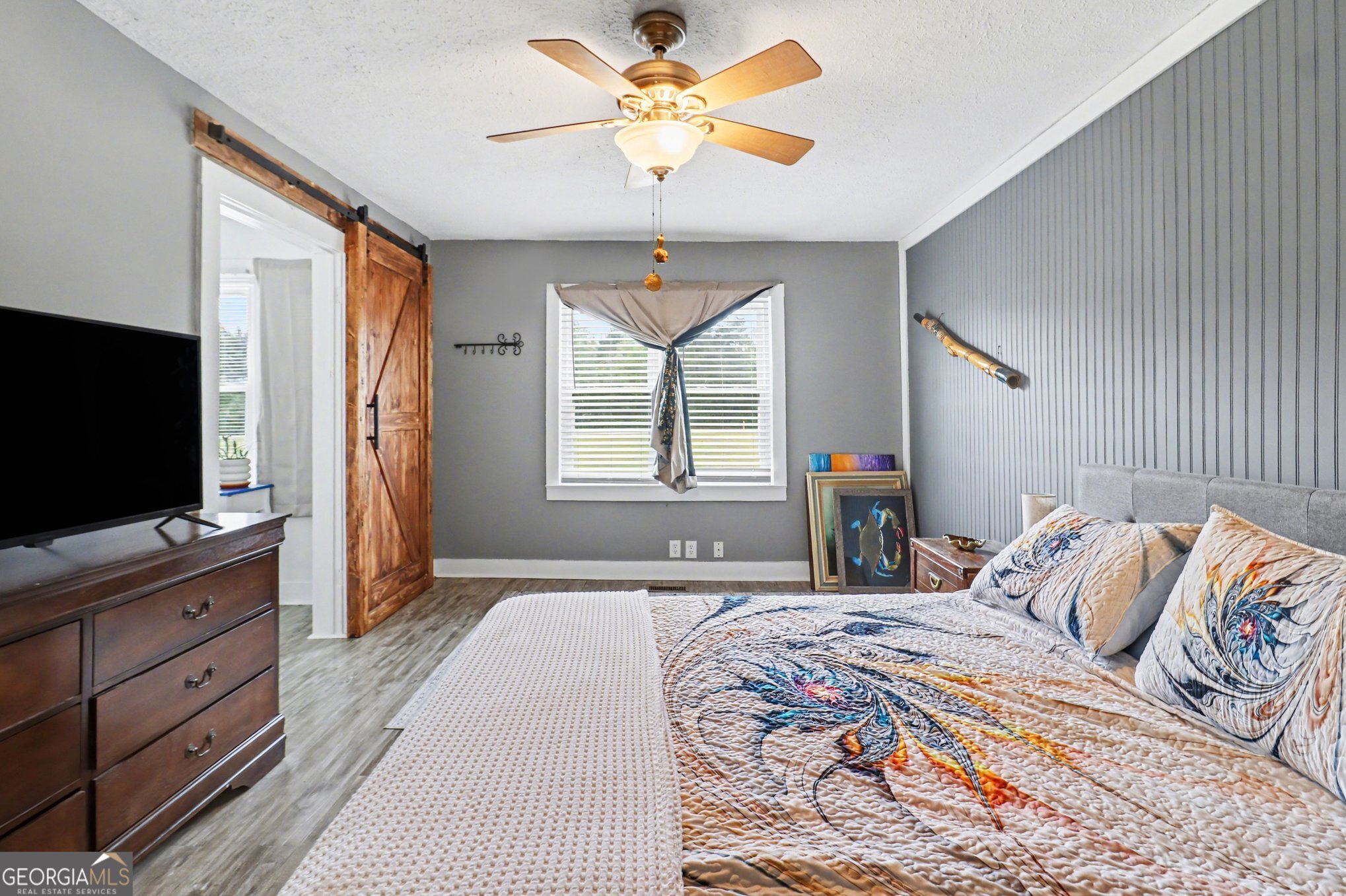 497 Corinth Road Hogansville, GA 30230 - Photo 23 of 37 a bedroom with a bed and a flat screen tv