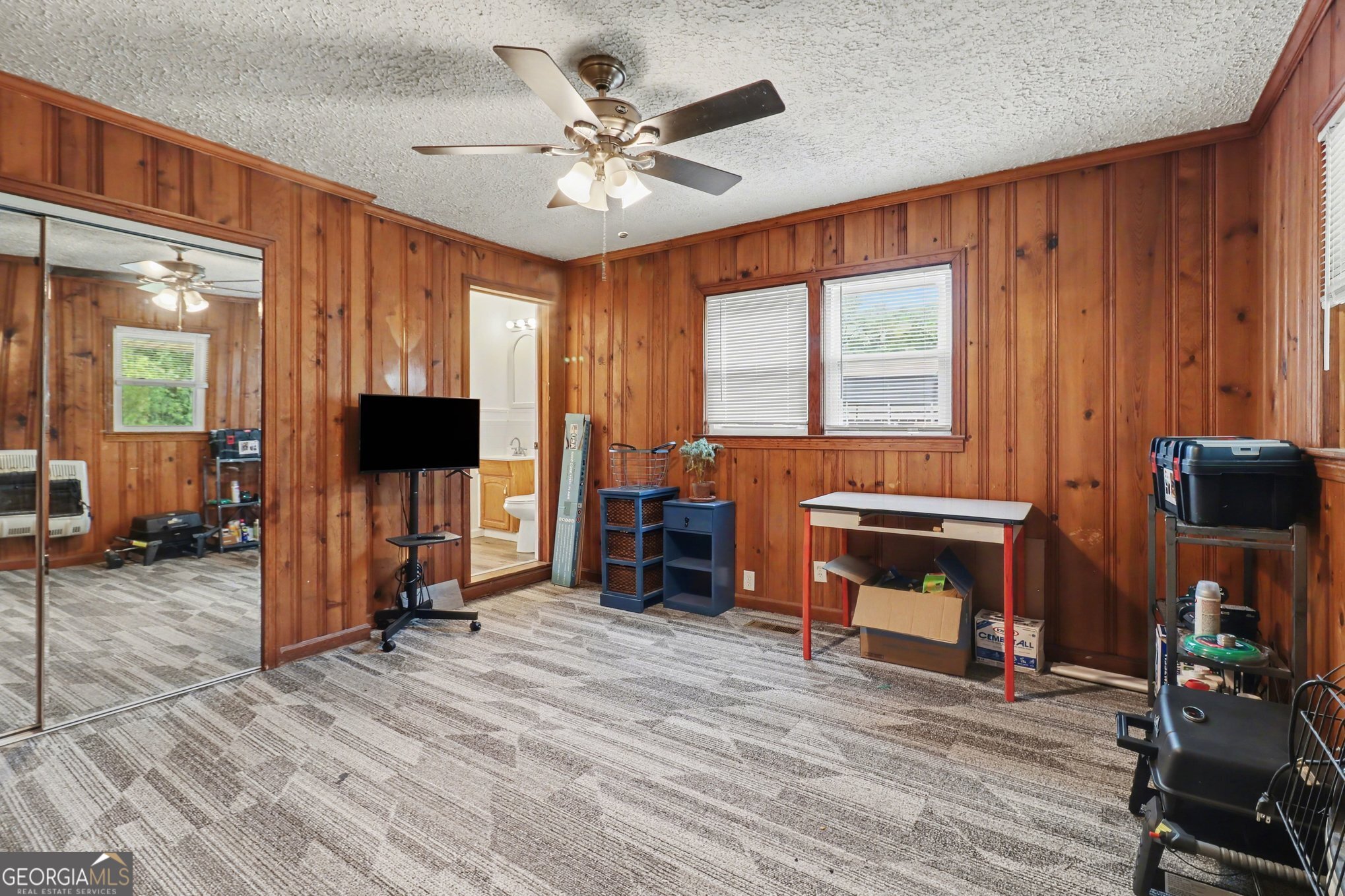 497 Corinth Road Hogansville, GA 30230 - Photo 24 of 37 a view of a livingroom with furniture and a flat screen tv