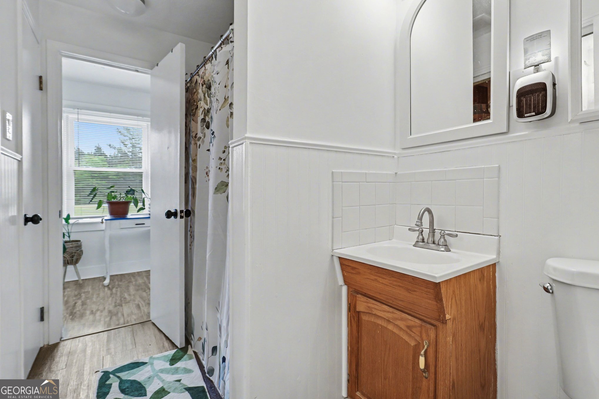 497 Corinth Road Hogansville, GA 30230 - Photo 25 of 37 a bathroom with a sink a toilet and shower