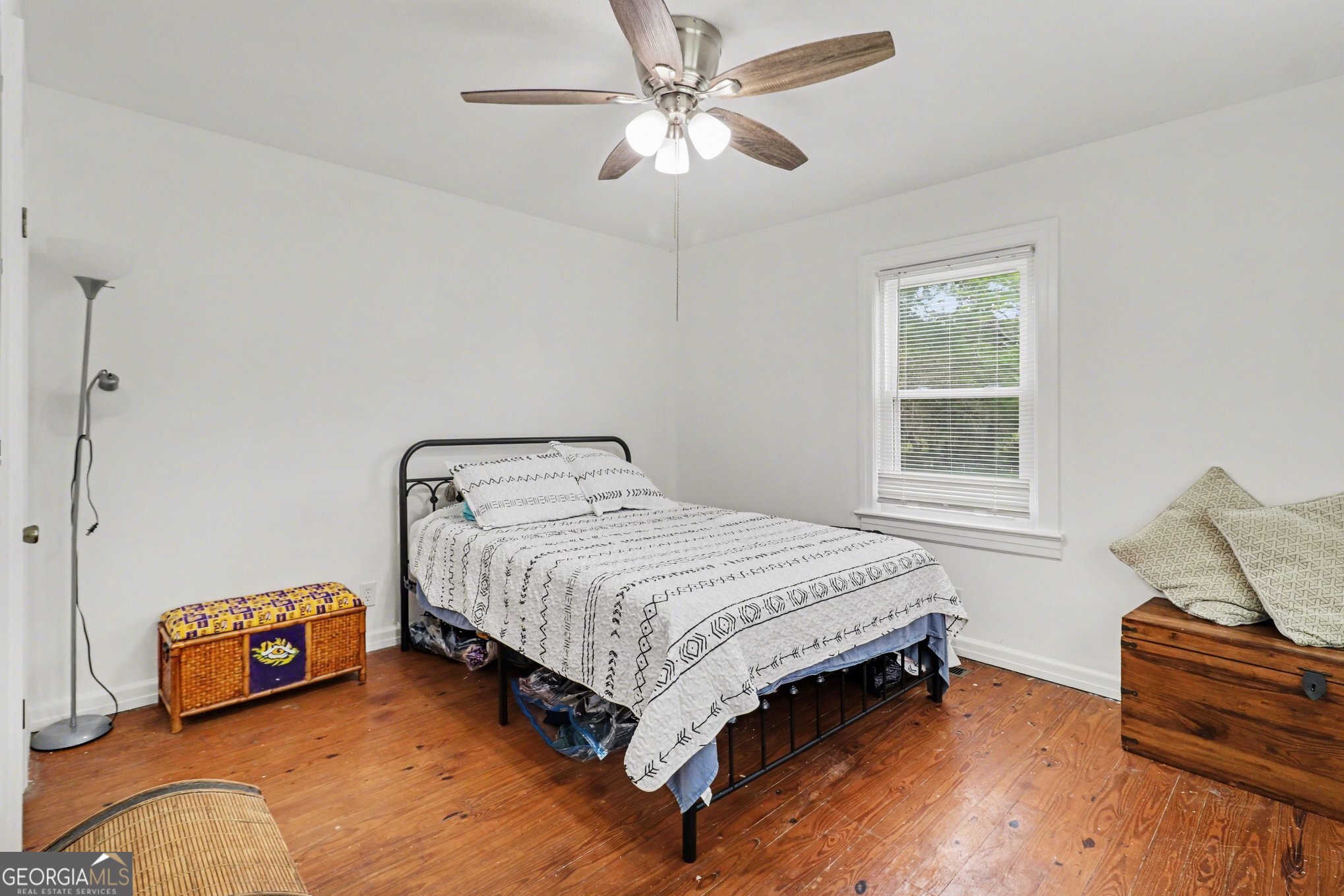 497 Corinth Road Hogansville, GA 30230 - Photo 26 of 37 a bedroom with a bed and a chandelier