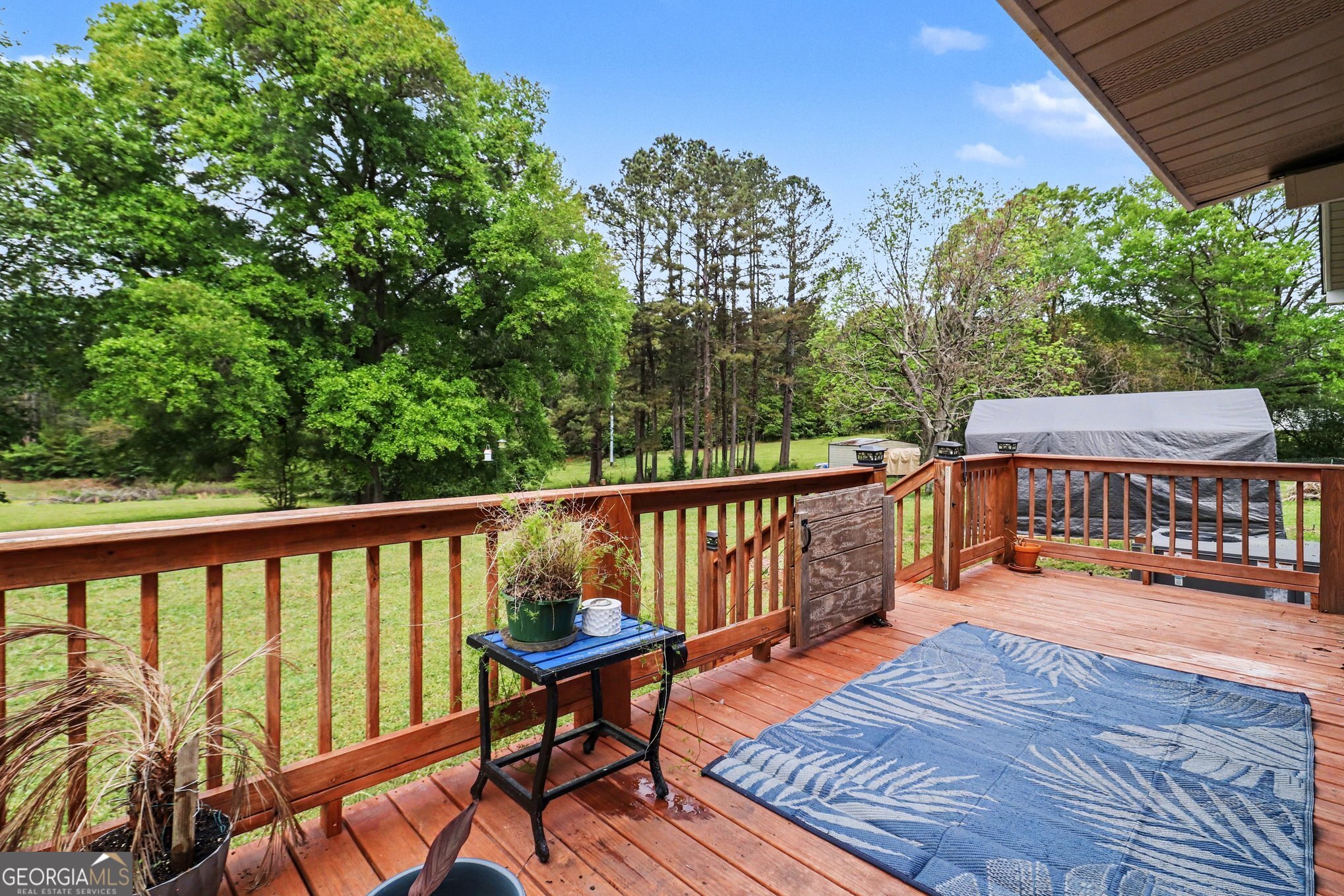497 Corinth Road Hogansville, GA 30230 - Photo 29 of 37 a balcony with wooden floor and outdoor seating