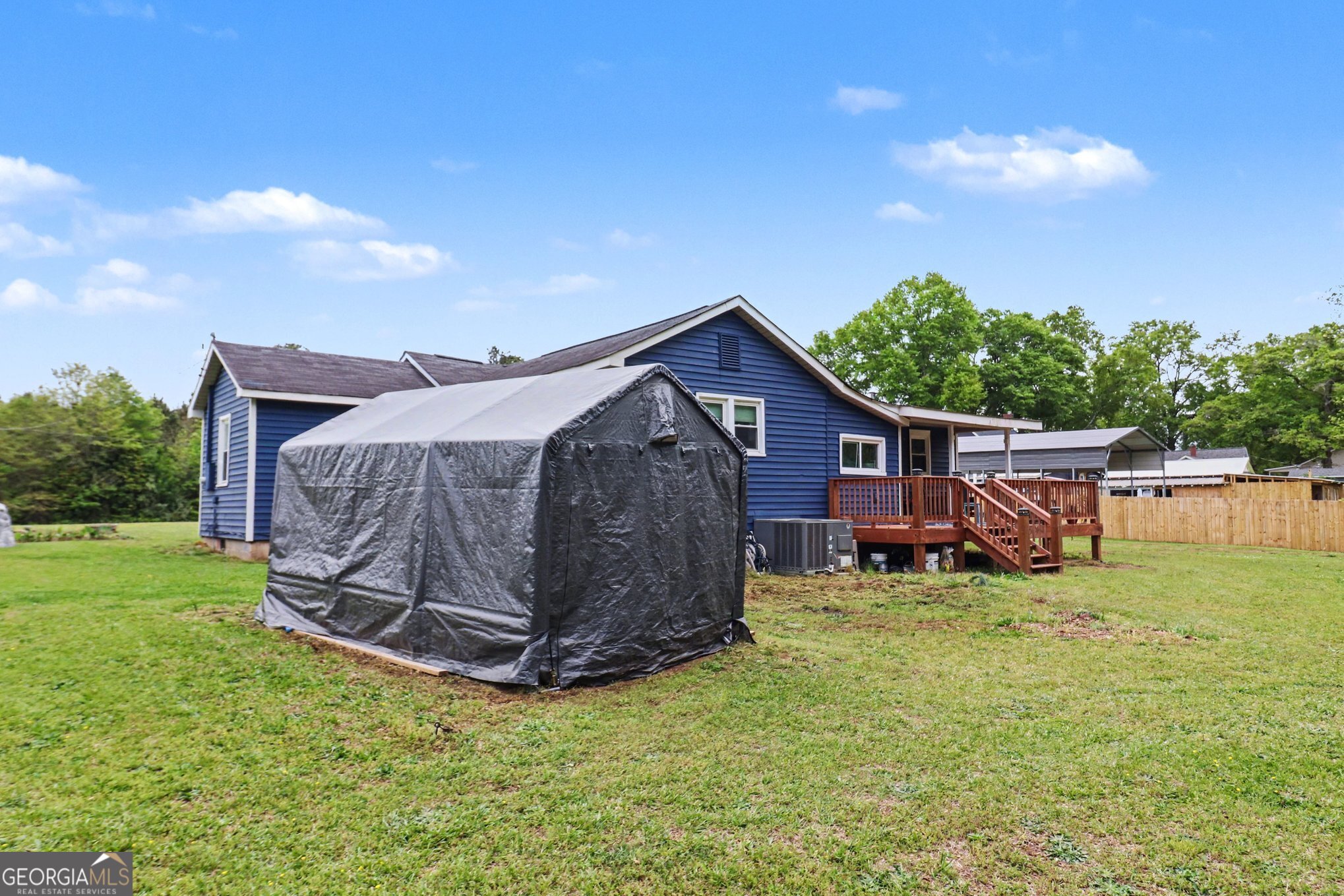 497 Corinth Road Hogansville, GA 30230 - Photo 31 of 37 a view of a house with a yard and sitting area