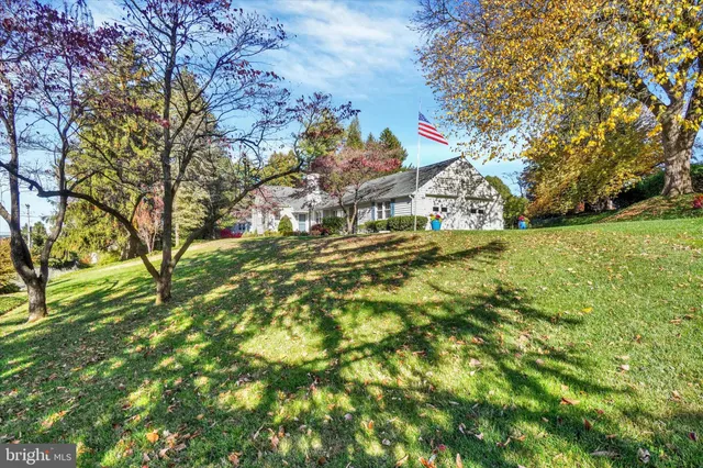 a backyard of a house with large trees
