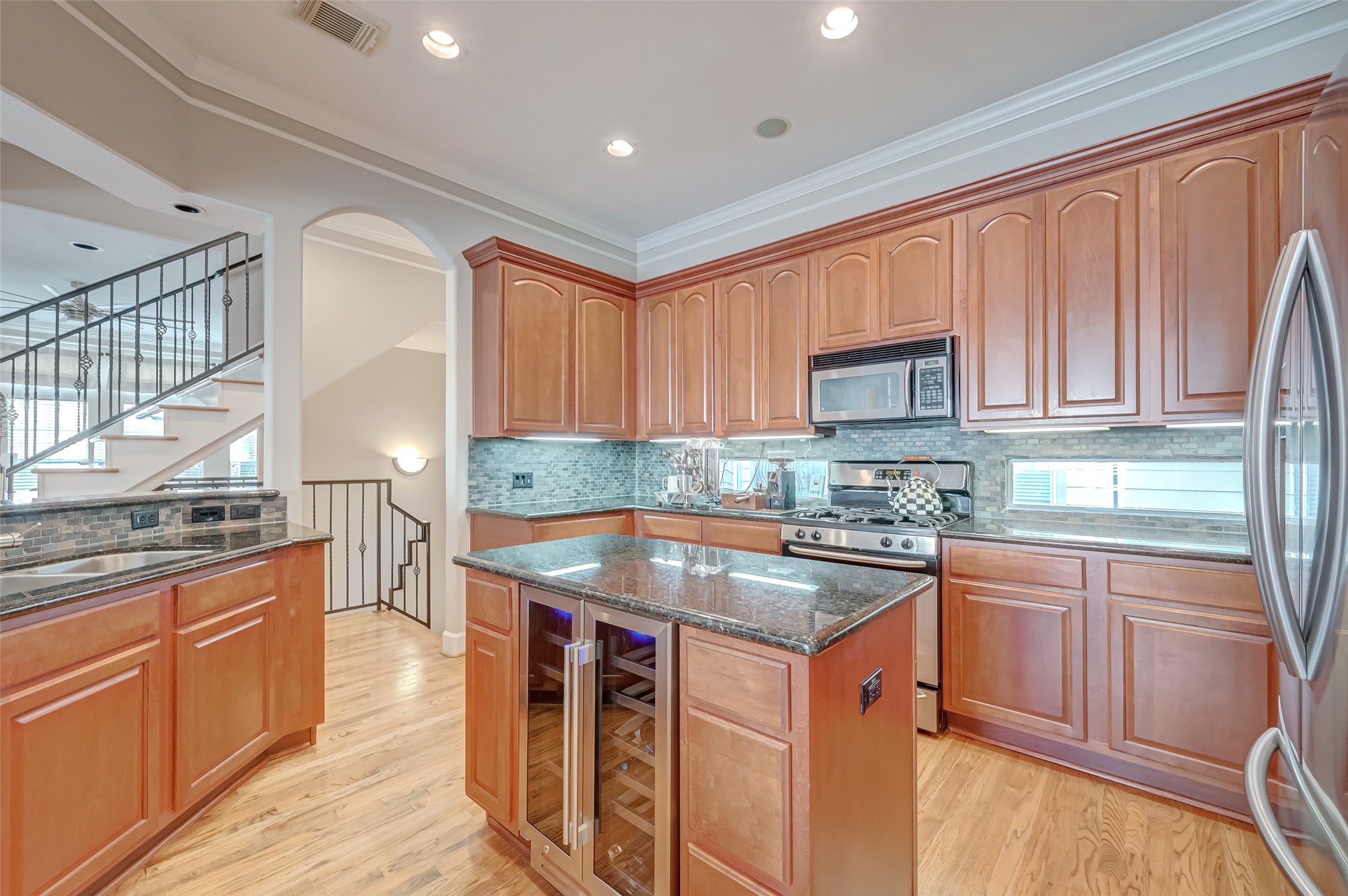 410 Fowler Street Houston, TX 77007 - Photo 15 of 49 a kitchen with stainless steel appliances granite countertop a sink stove and refrigerator