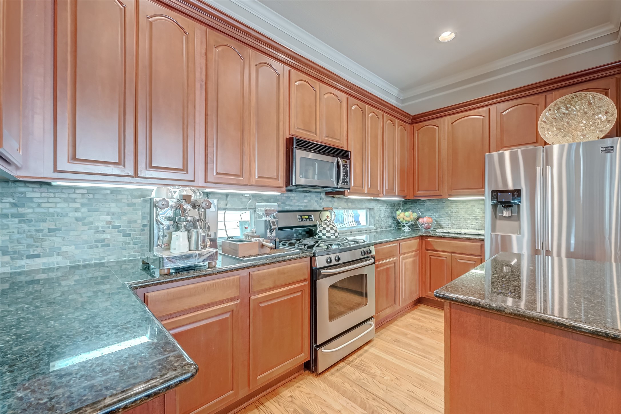 410 Fowler Street Houston, TX 77007 - Photo 17 of 49 a kitchen with stainless steel appliances granite countertop a refrigerator a stove and a sink