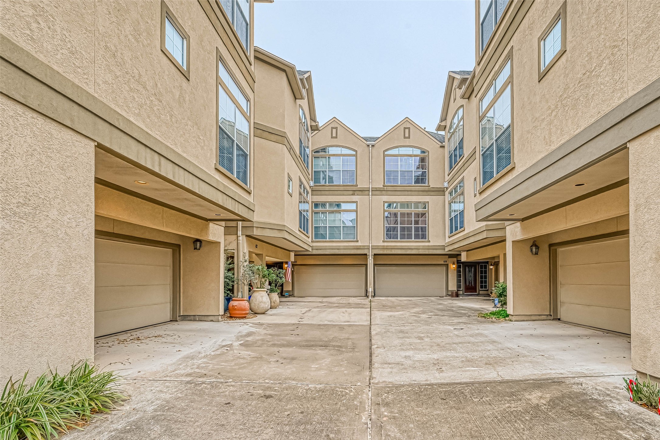 410 Fowler Street Houston, TX 77007 - Photo 2 of 49 front view of a brick house with a yard and a garage