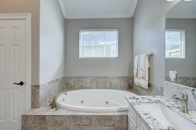 a backyard of a house with barbeque oven table and chairs