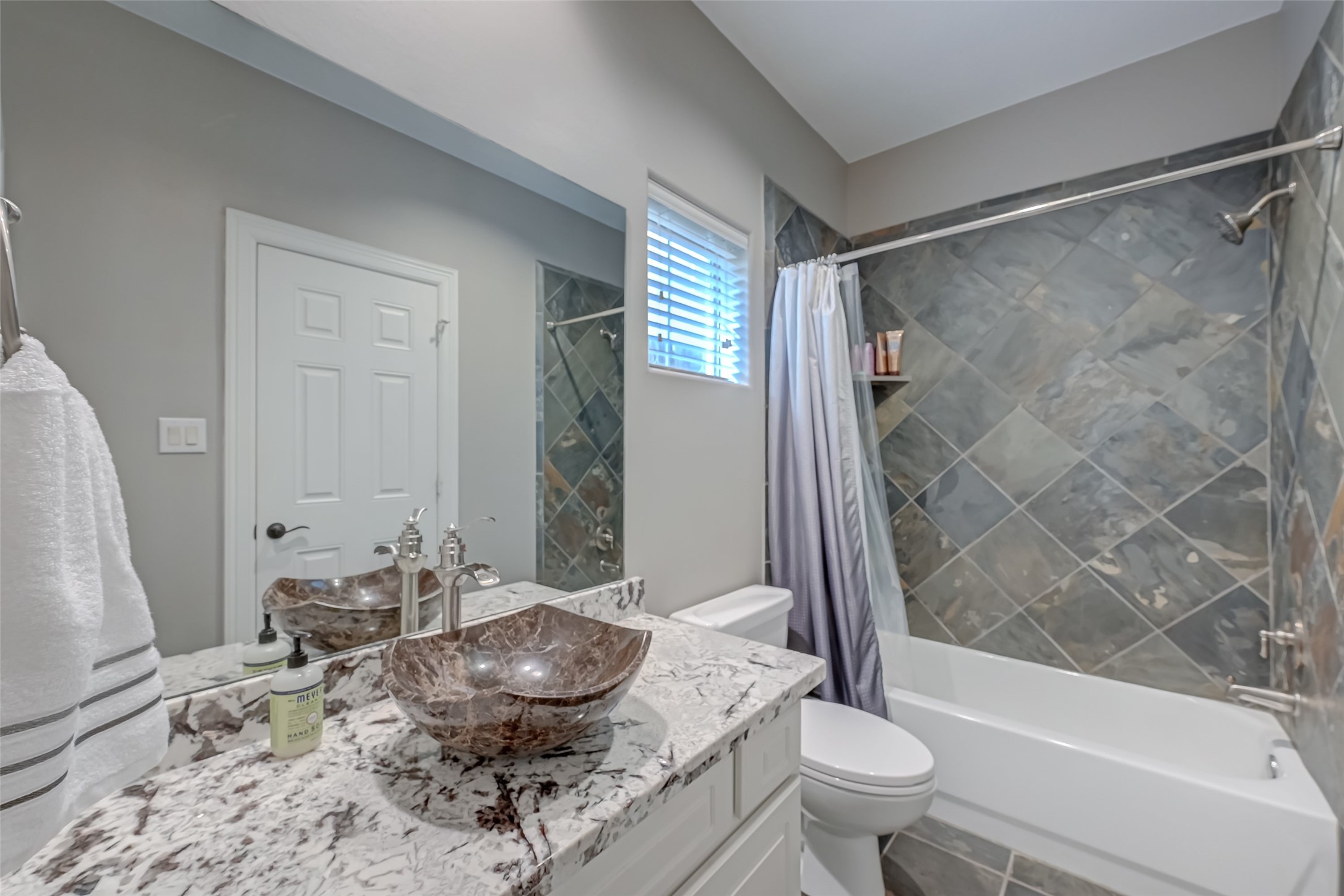 410 Fowler Street Houston, TX 77007 - Photo 31 of 49 a bathroom with a granite countertop sink toilet and shower