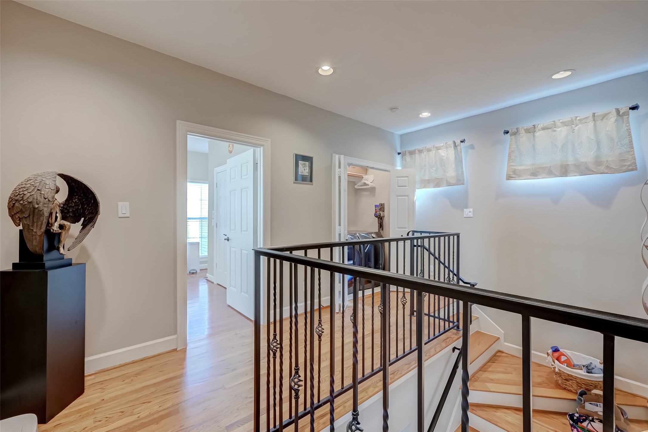 410 Fowler Street Houston, TX 77007 - Photo 38 of 49 a view of a hallway with wooden floor and stairs