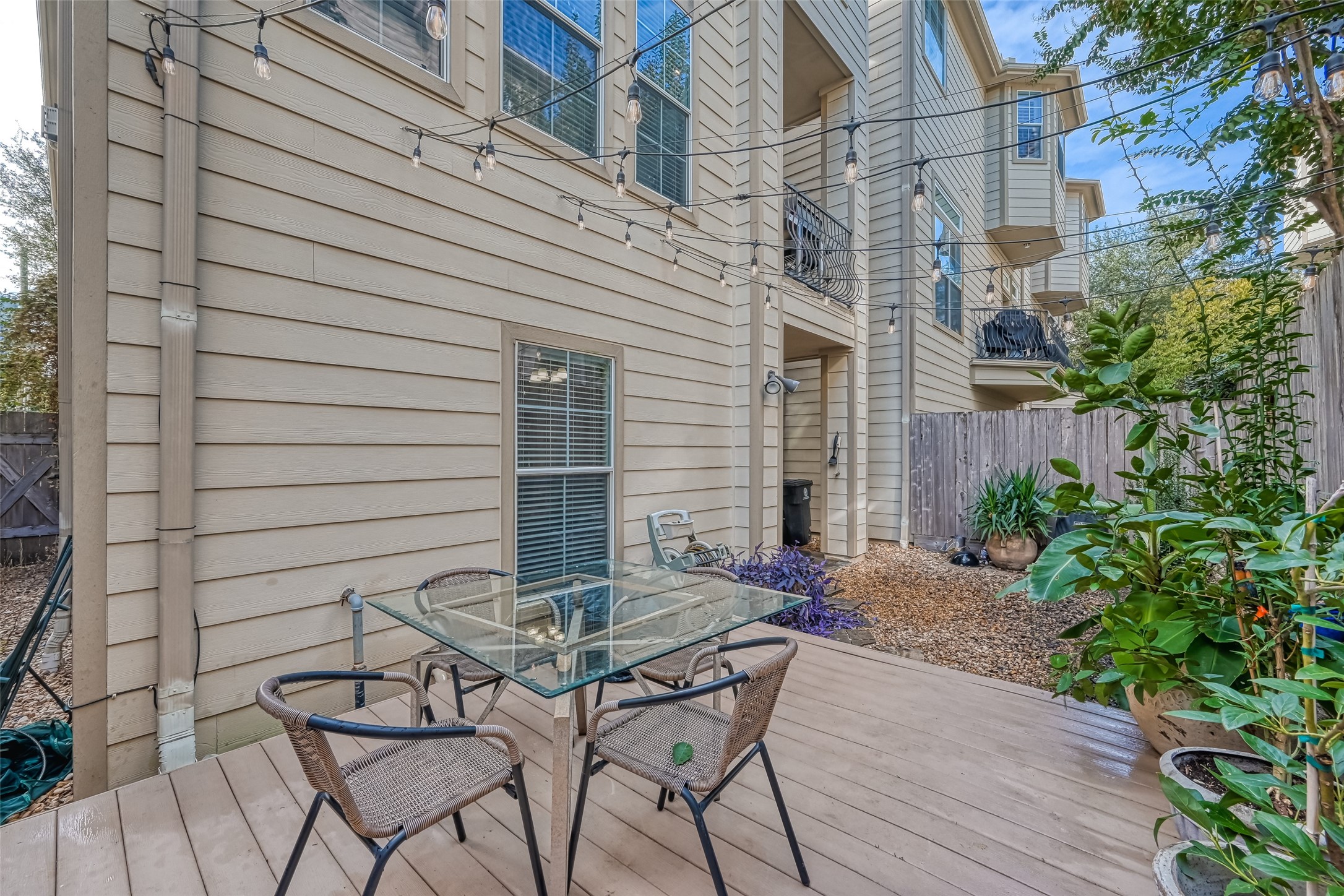 410 Fowler Street Houston, TX 77007 - Photo 46 of 49 a view of a patio with table and chairs and potted plants