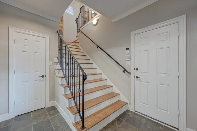 a view of a hallway with staircase