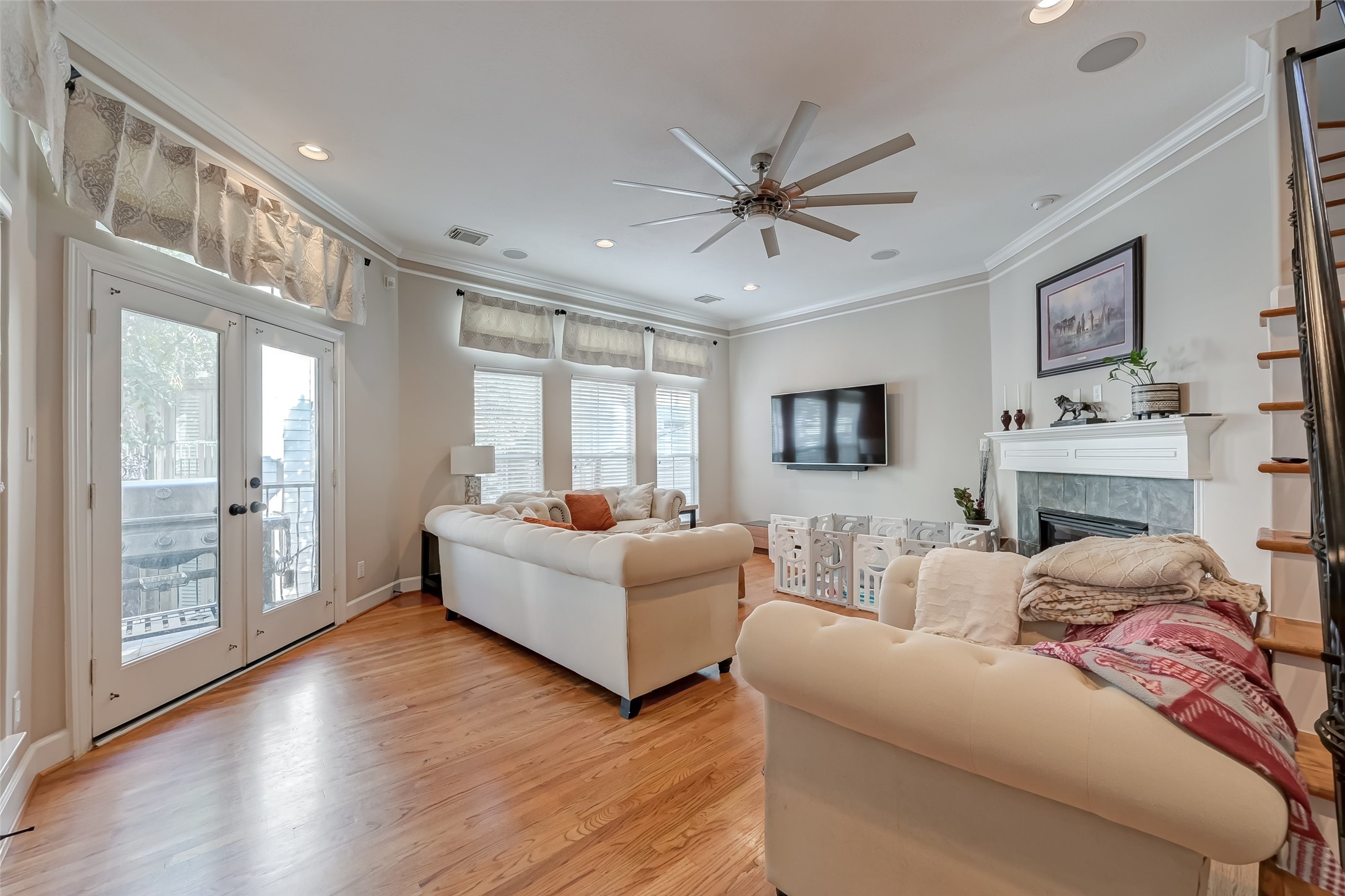 410 Fowler Street Houston, TX 77007 - Photo 7 of 49 a living room with furniture a large window with wooden floor