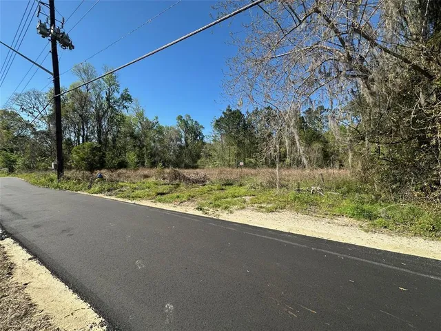 a view of a road with a yard