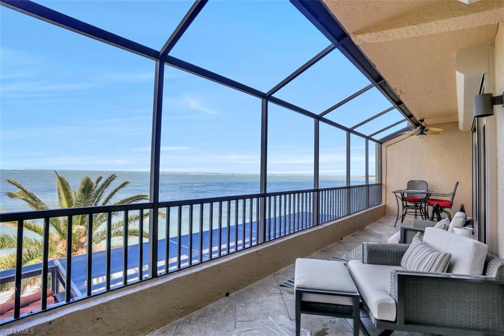 623 La Peninsula Boulevard, Unit 623 Naples, FL 34113 - Photo 25 of 27 a living room with furniture
