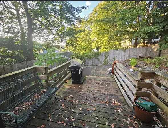 a view of a wooden floor with a trees in the background