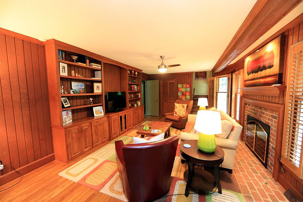 Large family room with fireplace and built ins. Open to breakfast and kitchen. Family Room