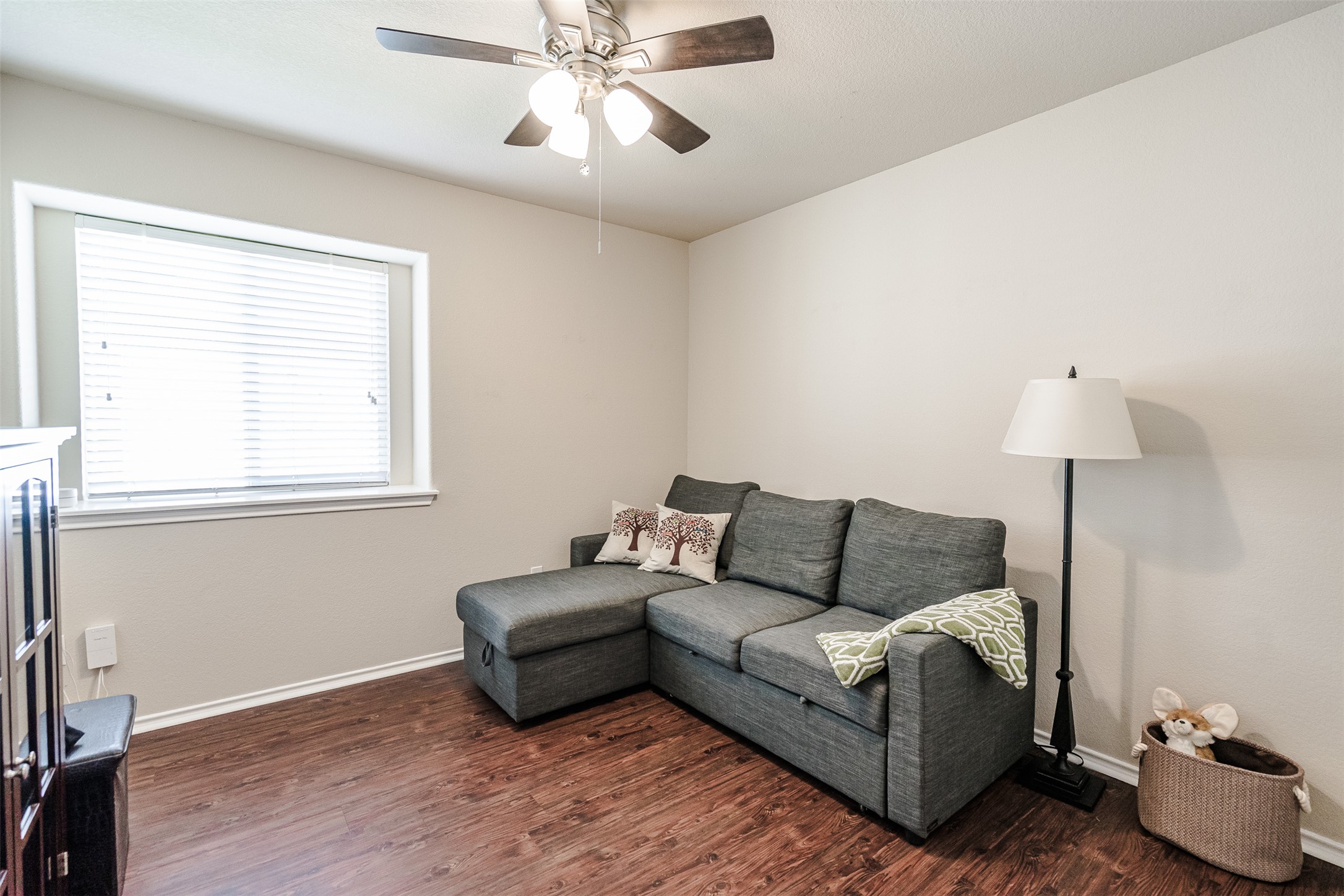 2404 Christoff Loop Austin, TX 78748 - Photo 8 of 24 Bedroom with dark wood finished floors and ceiling fan.