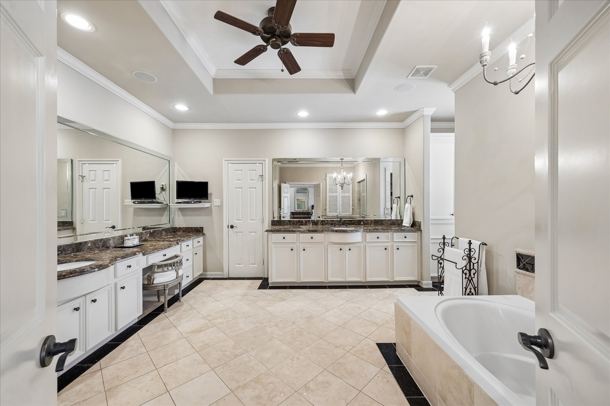 802 Anderson Street Bellaire, TX 77401 - Photo 18 of 36 The primary bath is oversized with timeless marble countertops, travertine tiles, oversized jetted tub, seperate double shower, private water closet, and the most abundantly sized closet. The primary bedroom also offers an additional large closet.
